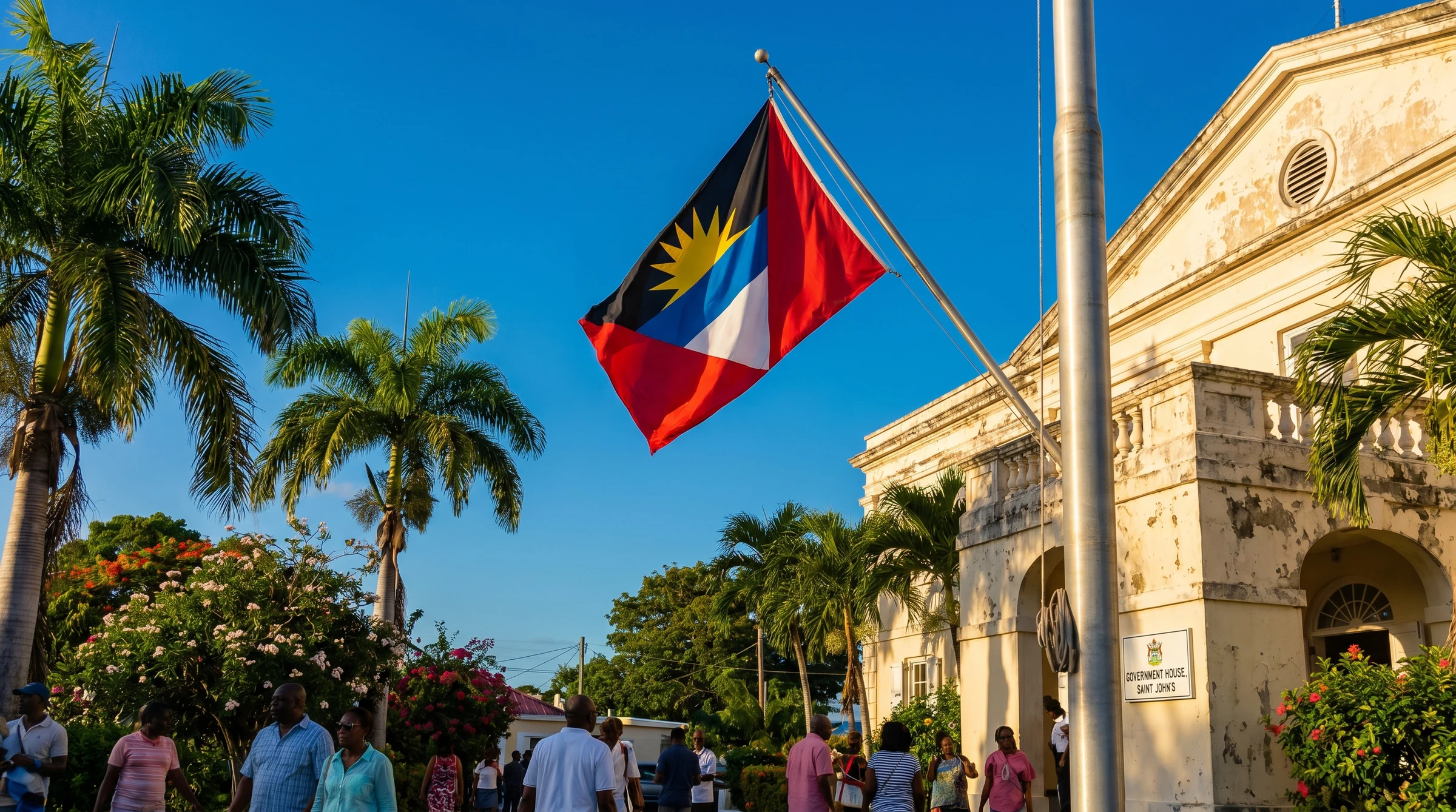 The flag of Antigua and Barbuda flying at a government building.